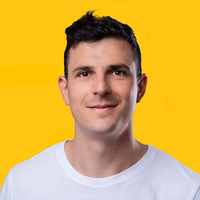 A professional headshot of Stefano