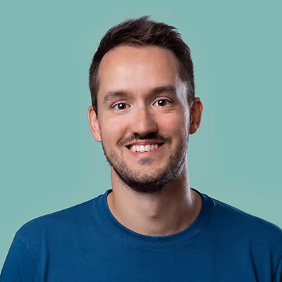 A professional headshot of Paolo